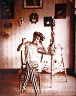 Bellocq, E. J. Photograph of Woman in Striped Leggings. 1915.