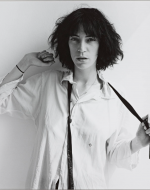 Mapplethorpe, Robert. Patti Smith in white shirt. 1975.