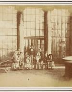 Photograph of Queen Victoria (1819-1901) and Prince Albert (1819-61) with seven of their children, posed outside Buckingham Palace.